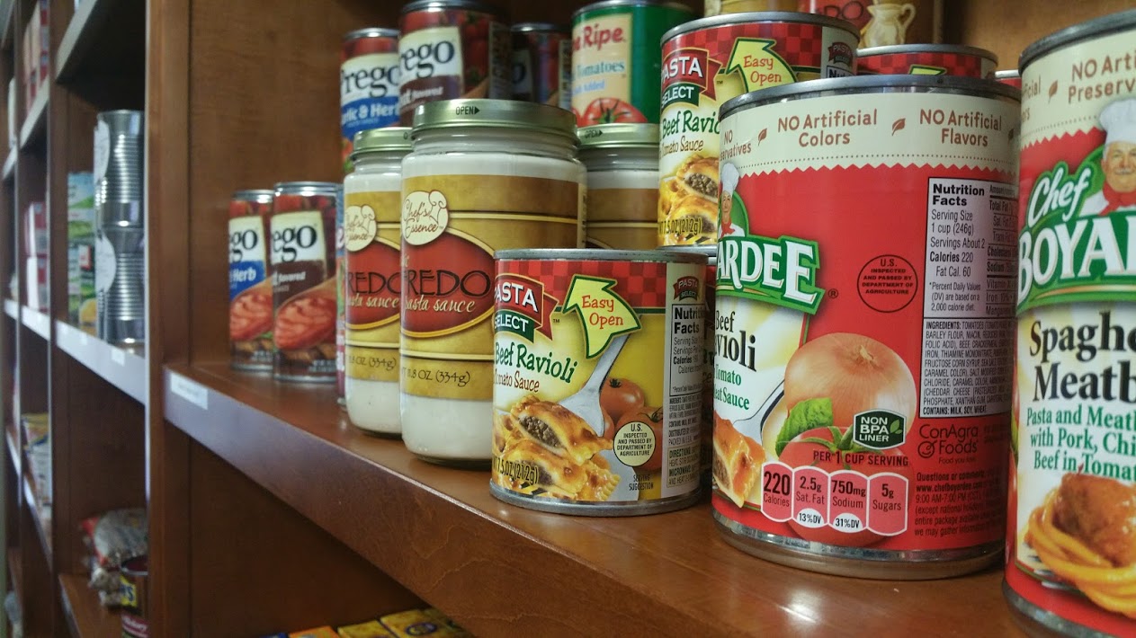 Various canned goods on a shelf